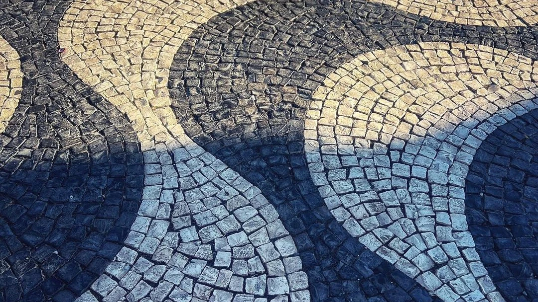 Portuguese pavement pattern in Lisbon, representing the training ground for guides